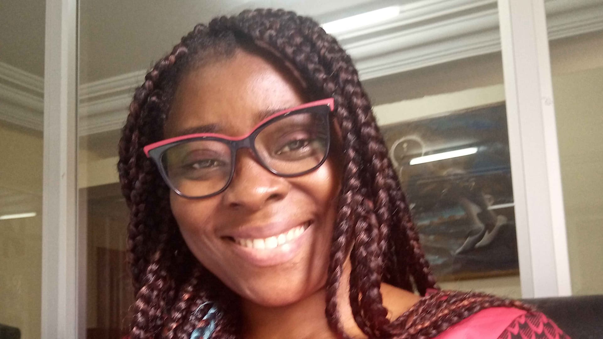 Arrey sharing an image of herself with a smile on her face.